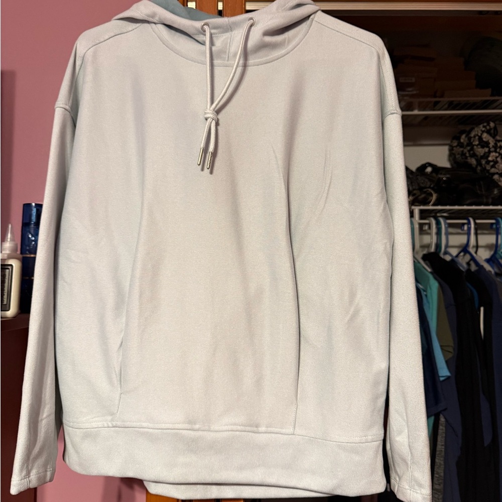 Women’s light blue hoodie.  Never worn. Has pockets in front.